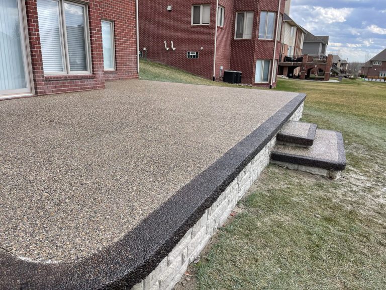 aggregate concrete patio off of house