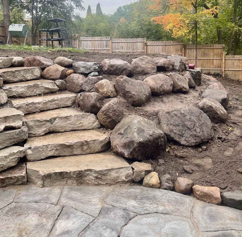 retraining wall graded with steps and a patio