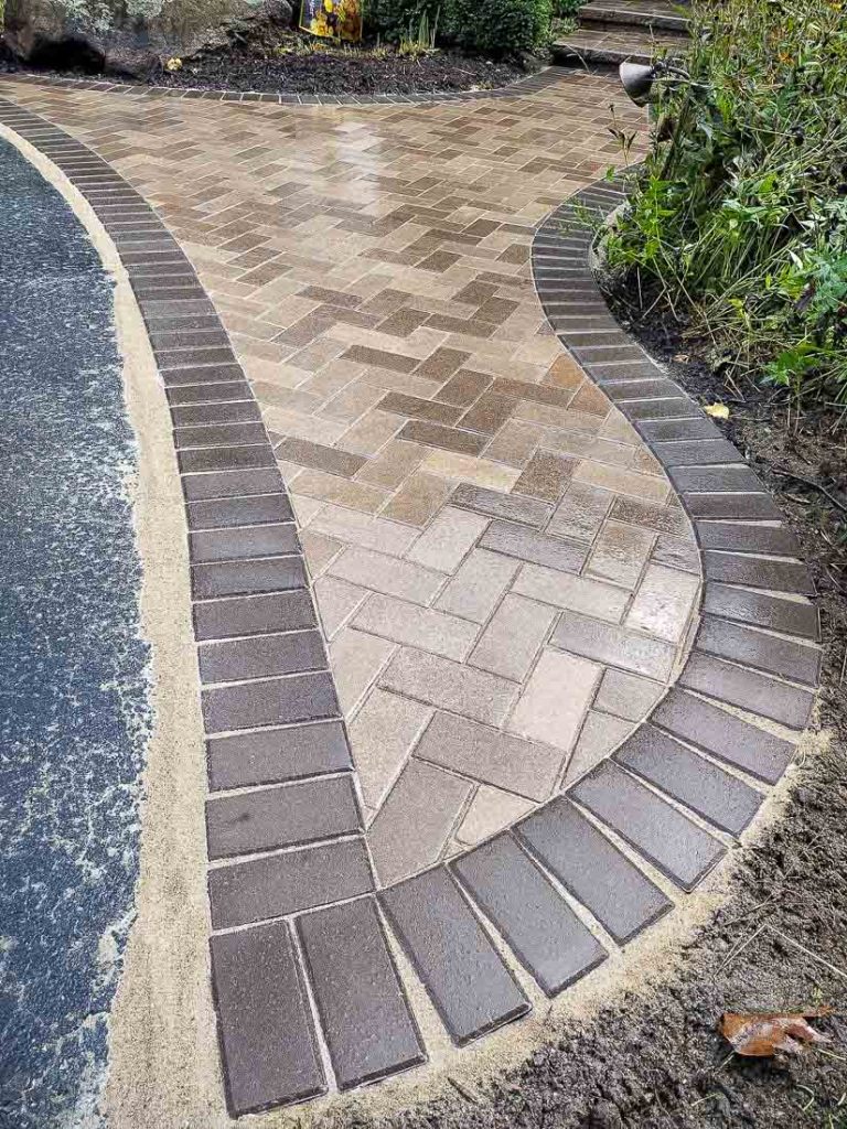 circular herringbone pattern brick paver design 