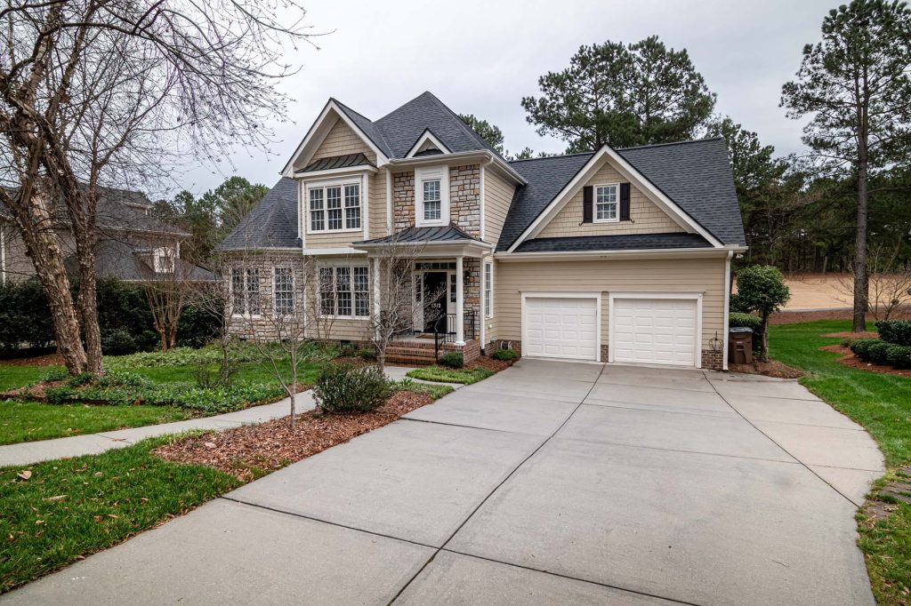 beautiful colonial home with concrete driveway