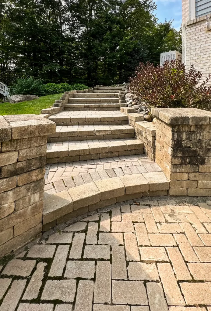paver patio, retaining wall and steps needing restoration