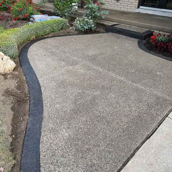 exposed aggregate concrete walkway front door approach